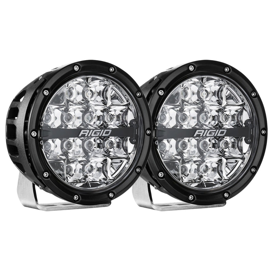 360-Series Round Lights by Rigid: A pair of black 6 inch round LED lights with clear spot optics on polished brackets against white.