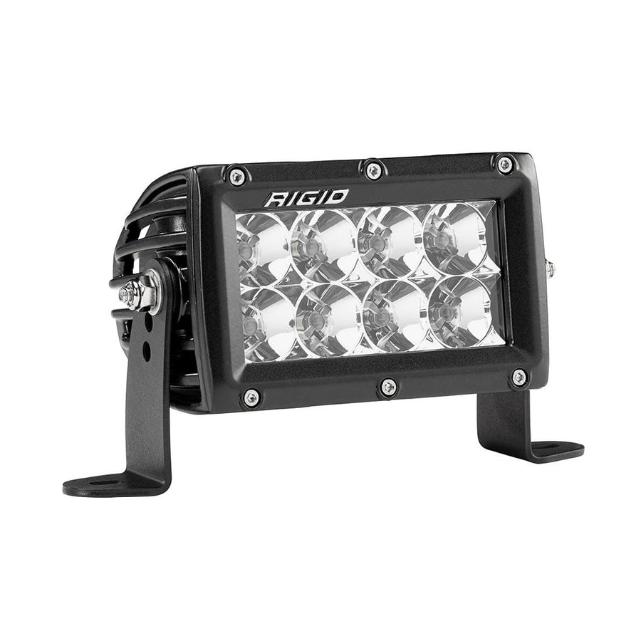 E-Series PRO Light Bars by Rigid: Black 4 inch E-Series PRO LED light with eight flood reflectors on side brackets, angled view against white.