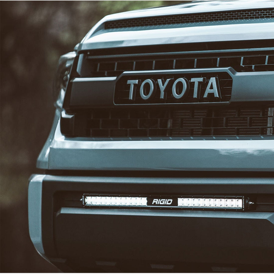 SR-Series Light Bars by Rigid: A gray Toyota Tundra front end with an unlit RIGID light bar fitted in the lower bumper opening.