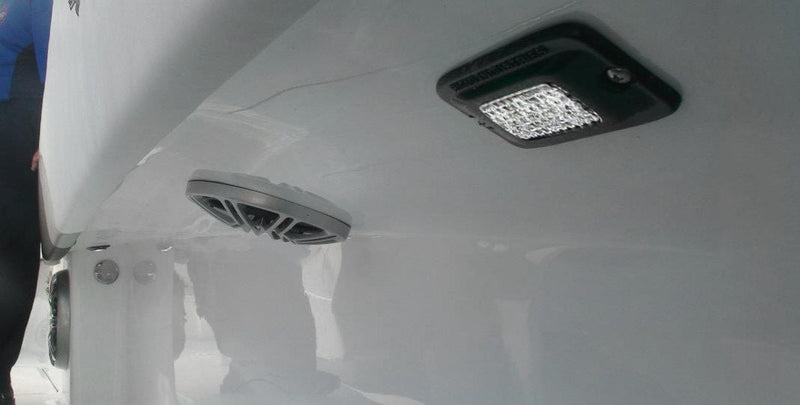 Rigid SR-M Series PRO Flood Diffused Flush Mount installed on a vehicle: A diffused flush-mount pod installed under the white hardtop of a boat