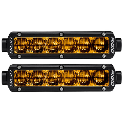 Rigid SR-Series 6" SAE Fog Lights Selective Yellow Pair, kit contents laid out: pair of black 6" SR-Series fog lights with selective yellow lenses, front view on white