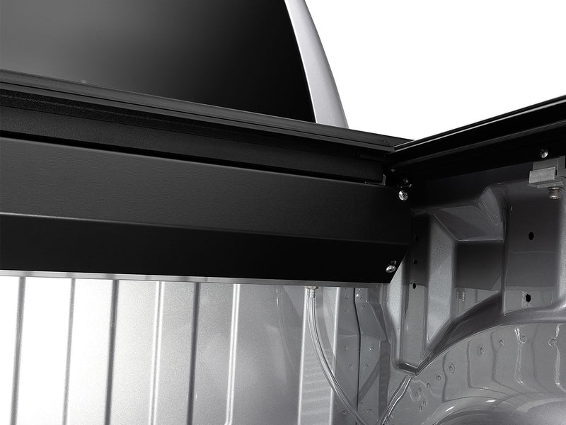 Roll-N-Lock A-Series canister housing seated at the bulkhead over a bare bed floor