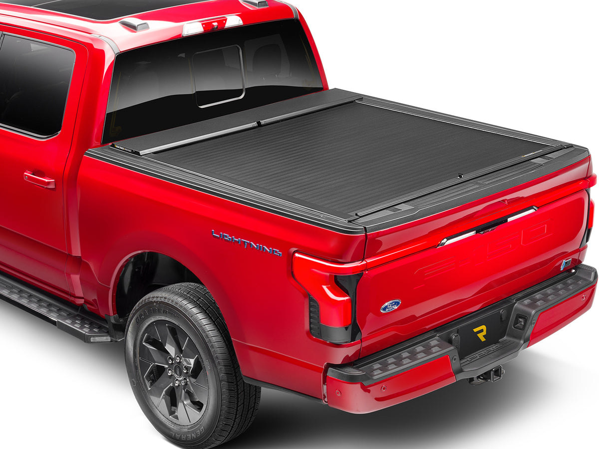 Roll-N-Lock A-Series closed over the bed, rear three-quarter view with the tailgate up