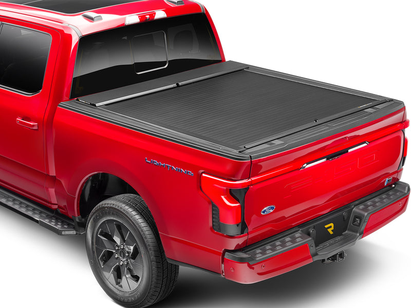 Roll-N-Lock A-Series closed over the bed, rear three-quarter view with the tailgate up
