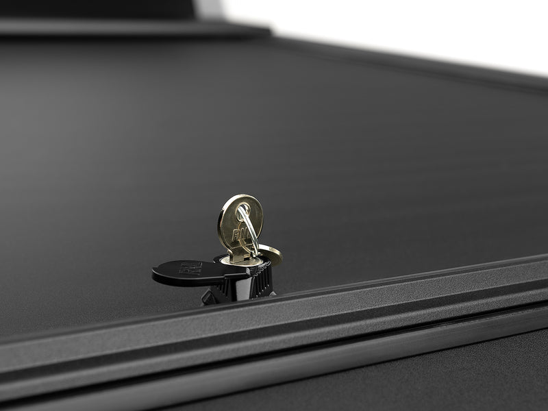 Roll-N-Lock A-Series lock cylinder with the key inserted, shot along the closed slat surface