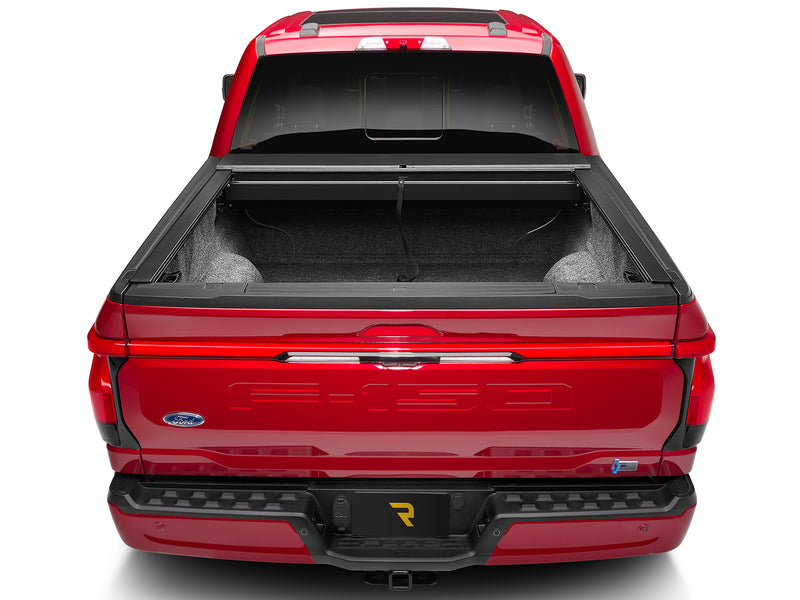 Roll-N-Lock A-Series fully retracted into its canister, straight rear view of the open bed