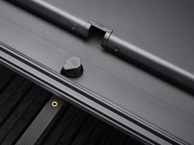 Roll-N-Lock A-Series XT MaxTrak T-slot rail with a tie-down knob and webbing eyelet