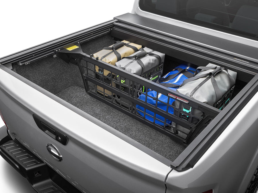 Roll-N-Lock Cargo Manager divider positioned in a truck bed