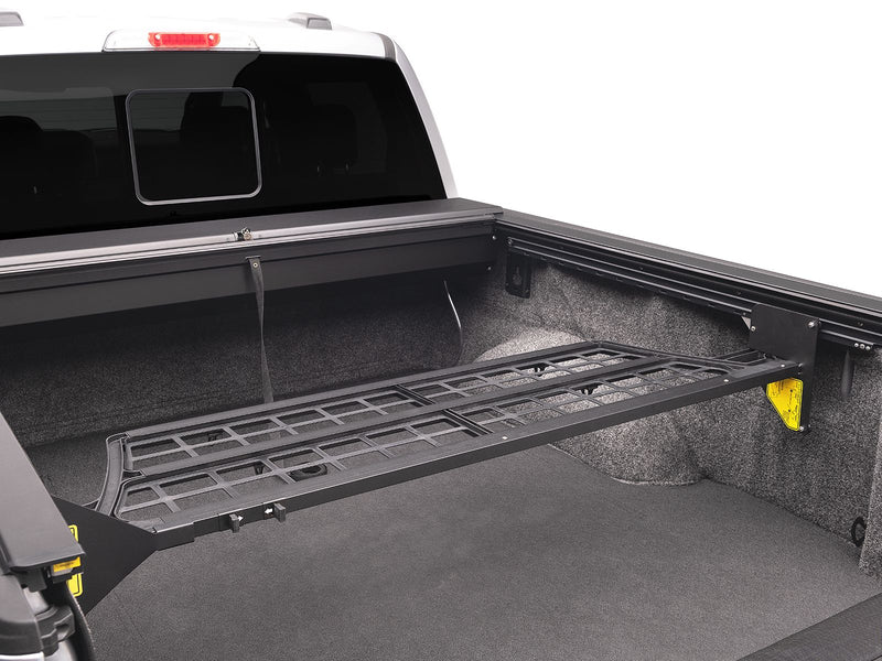Roll-N-Lock Cargo Manager folded flat along the bed floor in its stowed position
