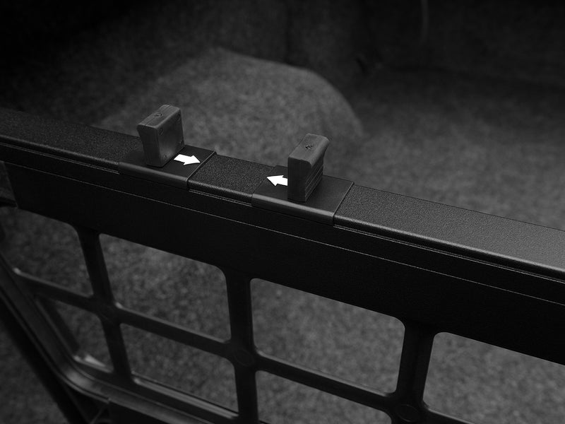Roll-N-Lock Cargo Manager grid panel with the two white directional arrows on its slider
