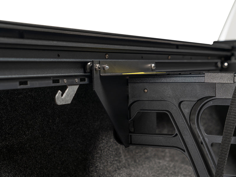 Roll-N-Lock Cargo Manager rail and its catch against the bed wall