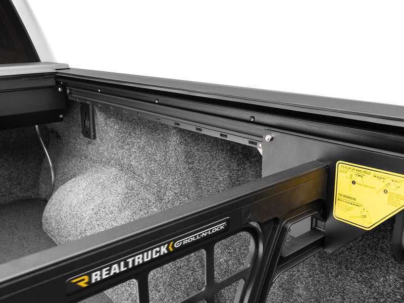 Roll-N-Lock Cargo Manager upper rail carrying the Roll-N-Lock name plate