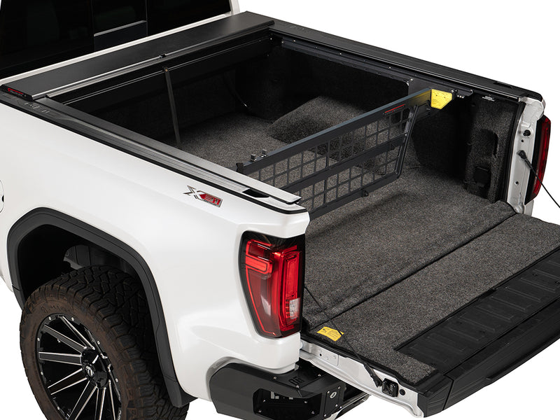 Roll-N-Lock Cargo Manager raised in an open pickup bed, whole truck with the tailgate down