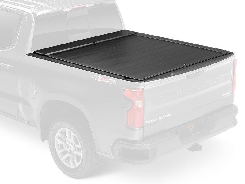 Roll-N-Lock E-Series shown fitted to a ghosted pickup, rear three-quarter view