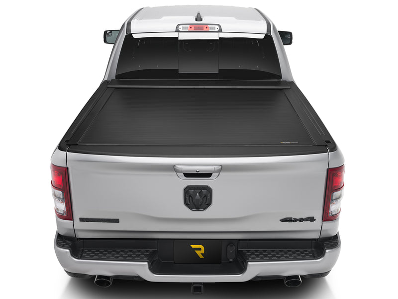 Roll-N-Lock E-Series electric cover closed over a pickup bed, straight rear view with the tailgate up