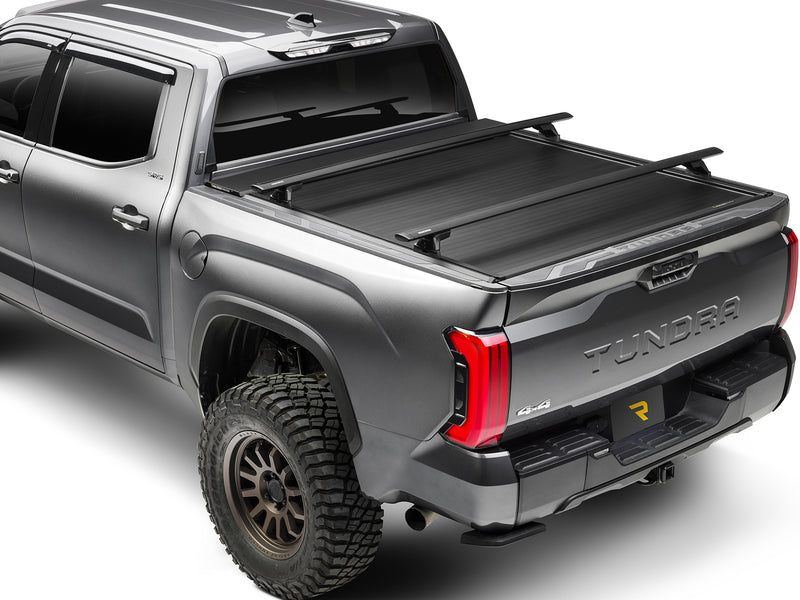 Crossbars mounted on the MaxTrak T-slot rails over a closed E-Series XT on a 2022-2026 Toyota Tundra