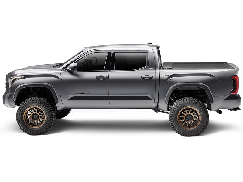 Roll-N-Lock E-Series XT closed, side profile of a lifted 2022-2026 Toyota Tundra