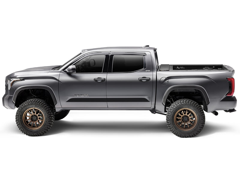 Roll-N-Lock E-Series XT fully open the length of the box, side profile of a 2022-2026 Toyota Tundra