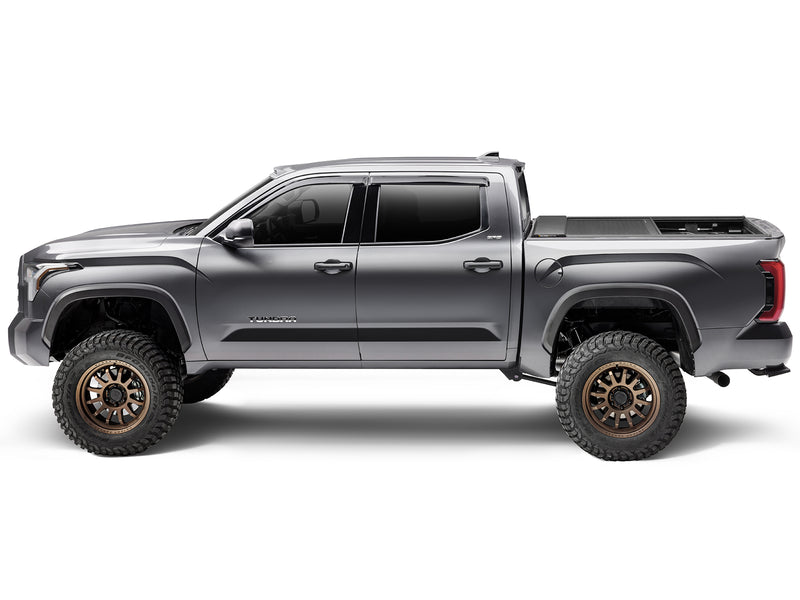 Roll-N-Lock E-Series XT retracted part way, side profile of a 2022-2026 Toyota Tundra