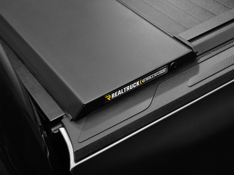 Roll-N-Lock E-Series XT name plate on the cover's front rail, cover closed