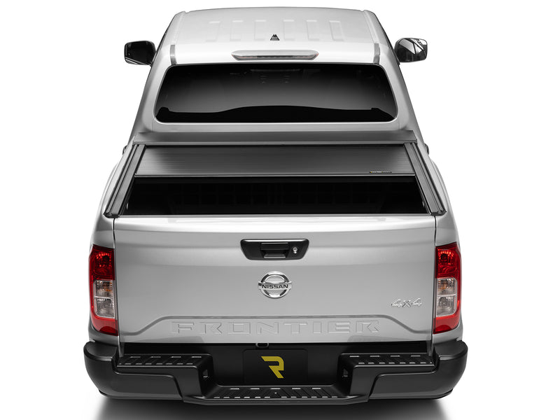 Roll-N-Lock E-Series XT shown stopped at several lock positions along the bed, straight rear view