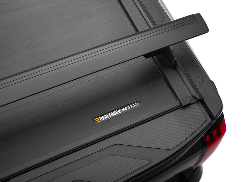 Roll-N-Lock name plate on the E-Series XT rail, photographed close against the cover surface