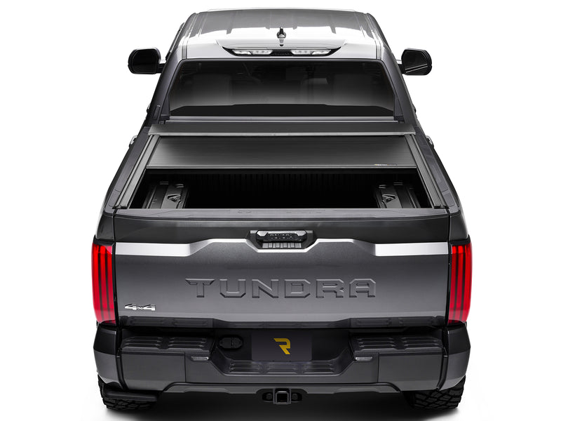 Roll-N-Lock E-Series XT retracted part way, straight rear view with the MaxTrak rails running down the bed