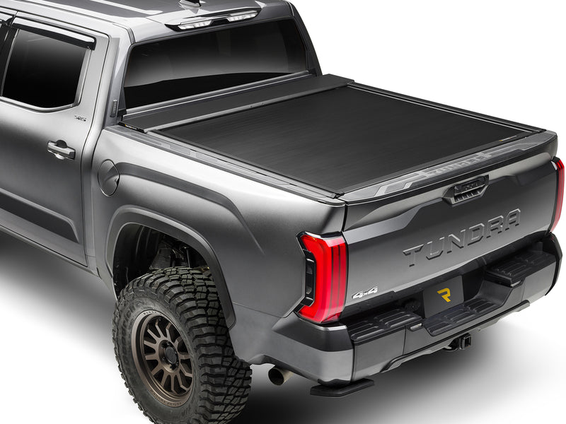 Roll-N-Lock E-Series XT closed over a pickup bed, rear three-quarter view with the tailgate up