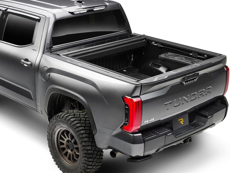 Roll-N-Lock E-Series XT fully retracted, rear three-quarter view with the T-slot rails exposed