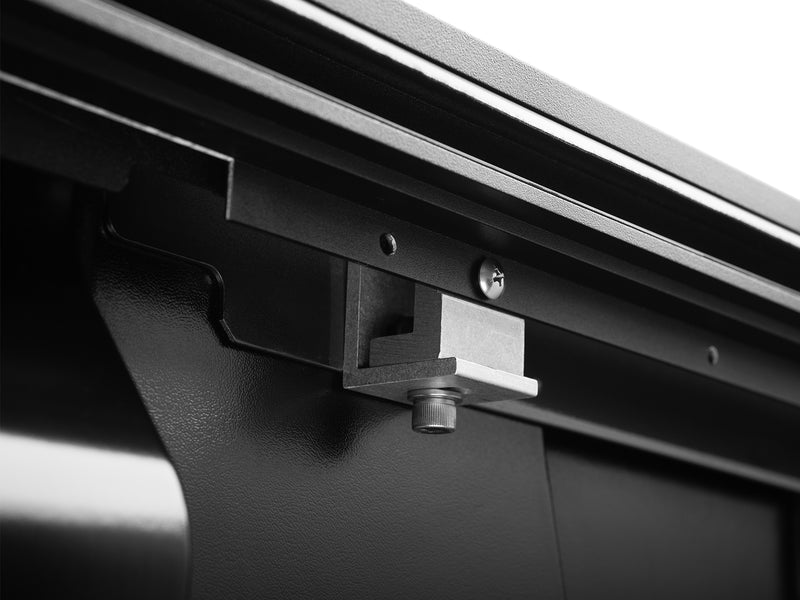 Roll-N-Lock E-Series XT underside rail clamp and bolt against the bed wall