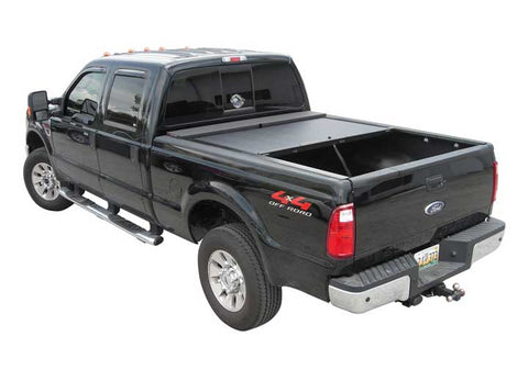Roll-N-Lock M-Series closed on a black Ford F-250 Super Duty crew cab