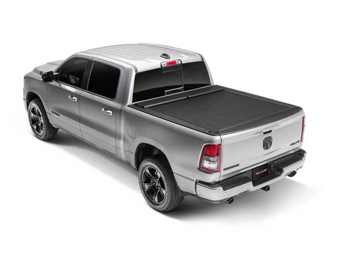 Roll-N-Lock M-Series closed on a silver 2019-2026 Ram 1500, rear three-quarter view