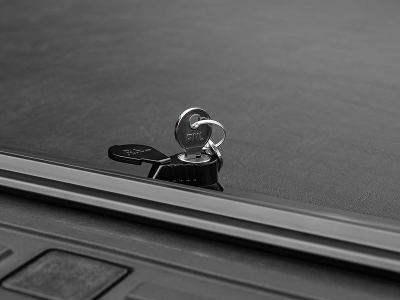 Roll-N-Lock M-Series keyed twist latch with the key inserted, cover closed