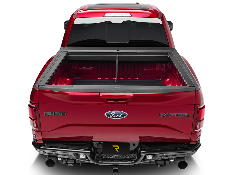 Roll-N-Lock M-Series fully retracted, straight rear view of the open bed