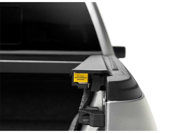 Roll-N-Lock M-Series side rail and end stop inside the truck bed