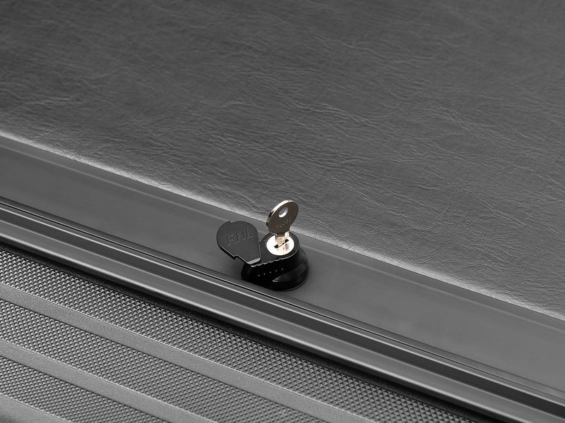 Roll-N-Lock M-Series XT keyed lock cylinder with the key inserted on the closed slat surface