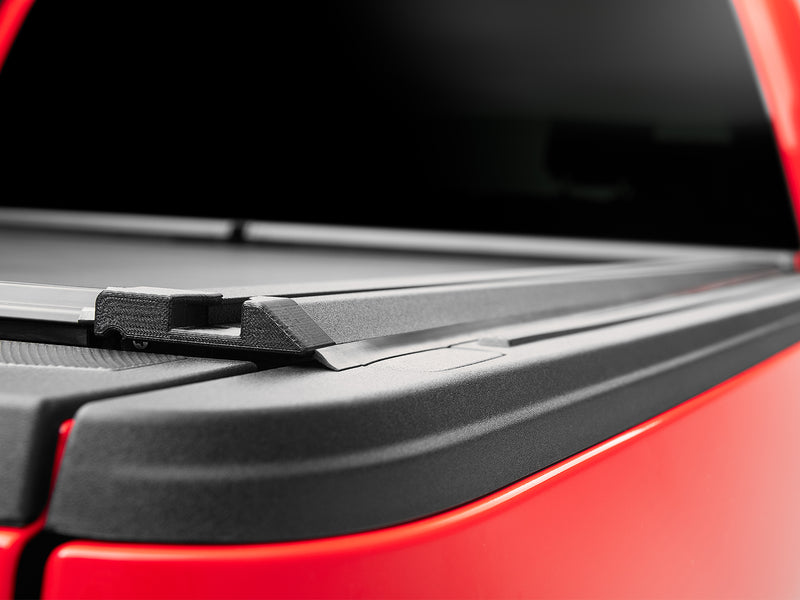 Roll-N-Lock M-Series XT MaxTrak rail end cap and tailgate seal at the bed rail