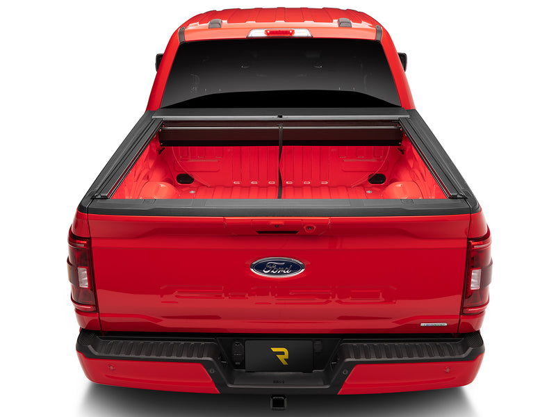 Roll-N-Lock M-Series XT fully retracted into its canister, straight rear view of the open bed
