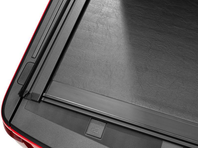 Close-up of the Roll-N-Lock M-Series XT vinyl slat surface meeting the bed rail