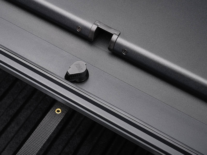 Roll-N-Lock A-Series XT T-slot side rail with a tie-down knob and webbing eyelet