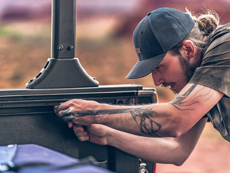Roll-N-Lock A-Series XT man fitting a rack upright to the T-slot side rail (rack sold separately)
