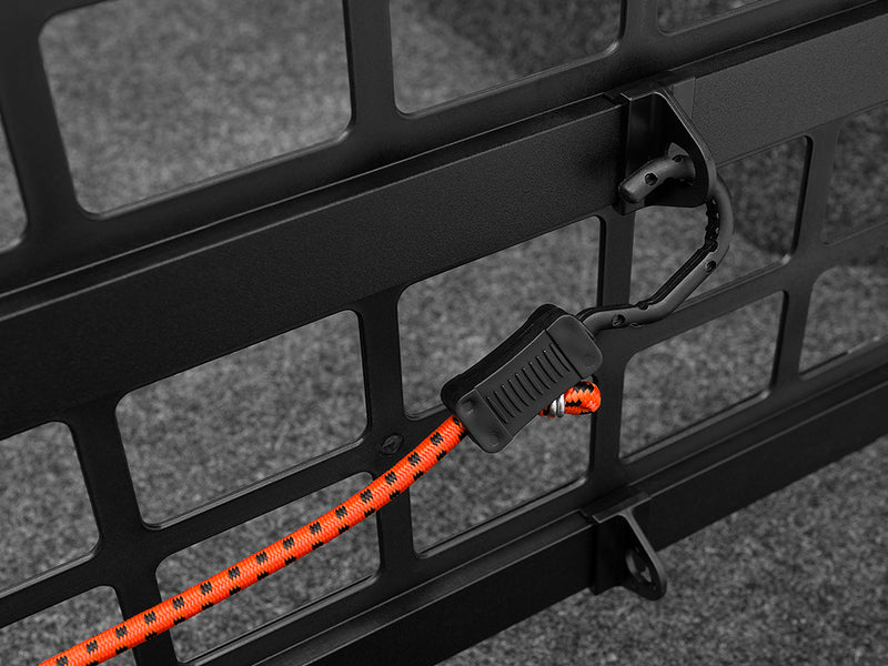 Roll-N-Lock Cargo Manager divider grid with a bungee cord hooked through it (bungee sold separately)