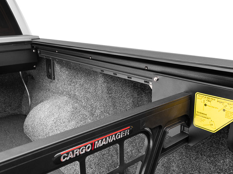 Roll-N-Lock Cargo Manager divider top rail with the Cargo Manager badge and yellow label