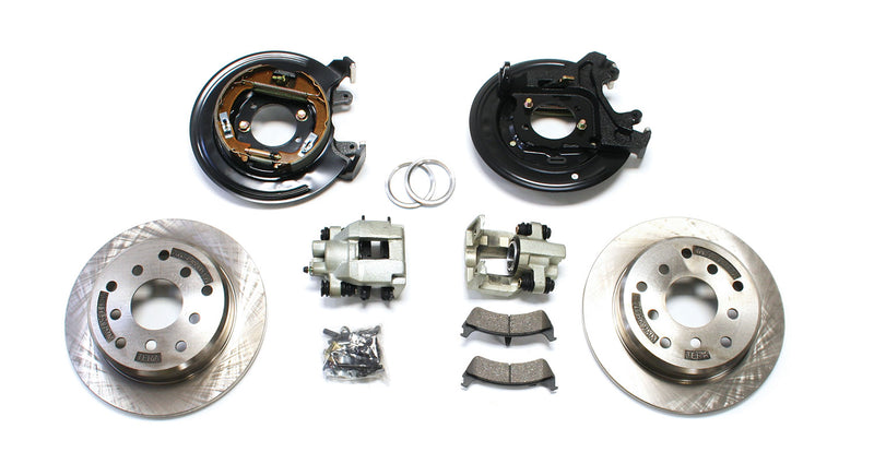 TeraFlex Brake Component, shown on a studio background: rear disc brake conversion kit laid out on white: backing plates, calipers, pads, TERA-stamped rotors and hardware