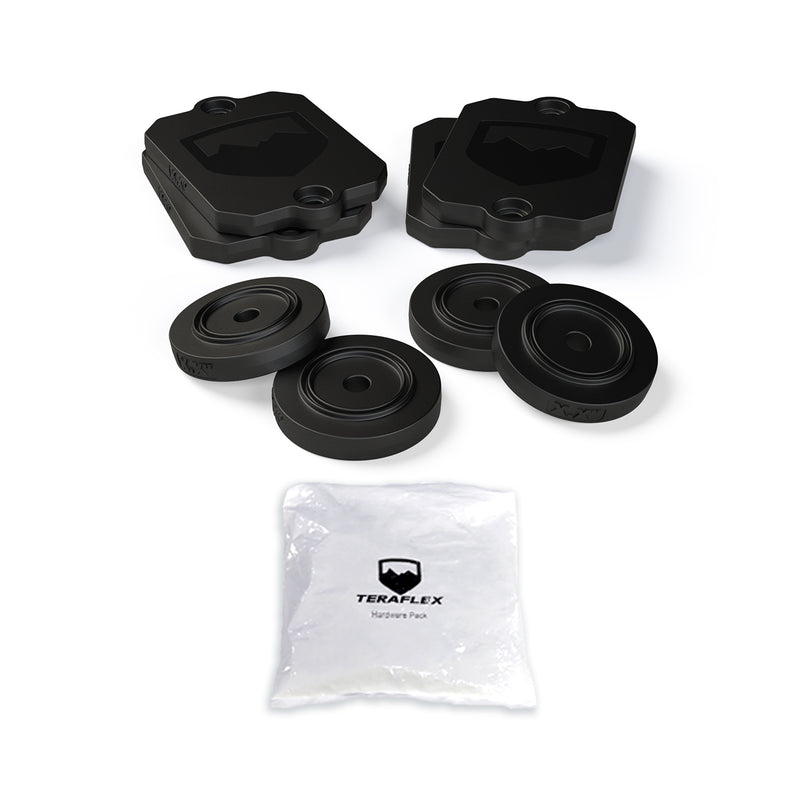 TeraFlex Bump Stop Kit, shown on a studio background: black TeraFlex bump stop spacer plates and round pucks with hardware pack on white