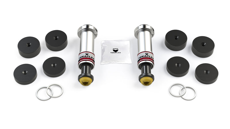 TeraFlex Bump Stop Kit, shown on a studio background: two TeraFlex SpeedBump bump stops, eight black spacers, four shim rings and a hardware bag on white