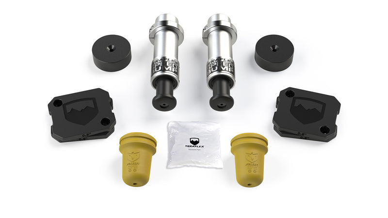 TeraFlex Bump Stop Kit, shown on a studio background: two TeraFlex SpeedBumps, black spacers, shield-logo pads and yellow Falcon bump stops with a hardware pack on white