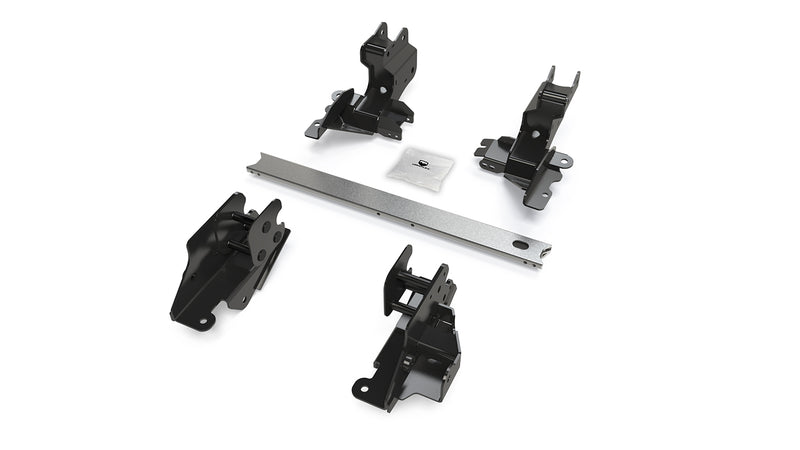 TeraFlex Long Arm Bracket Kit, shown on a studio background: four black TeraFlex control-arm frame brackets and a silver crossmember with hardware pack on white