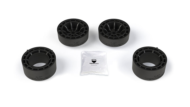 TeraFlex Performance Spacer Lift Kit, shown on a studio background: four black TeraFlex coil spring spacers (two 1.5-in, two 2.0-in) with a TeraFlex hardware pack on white