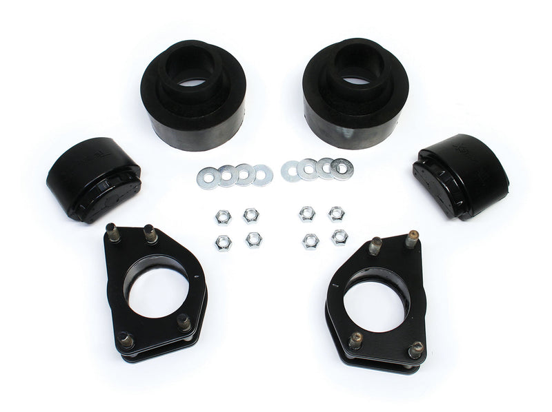TeraFlex Performance Spacer Lift Kit, shown on a studio background: photo of black coil spacers, bump stops, strut spacer plates and zinc hardware on white